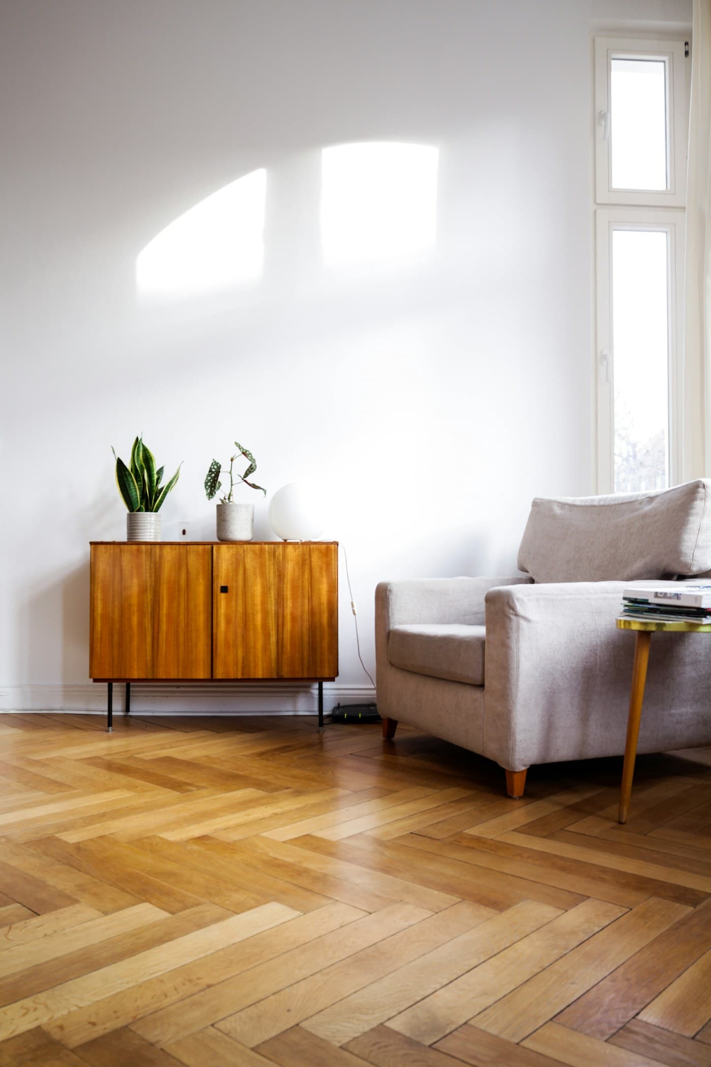 Freshly fitted engineered oak flooring running through an open-plan room.